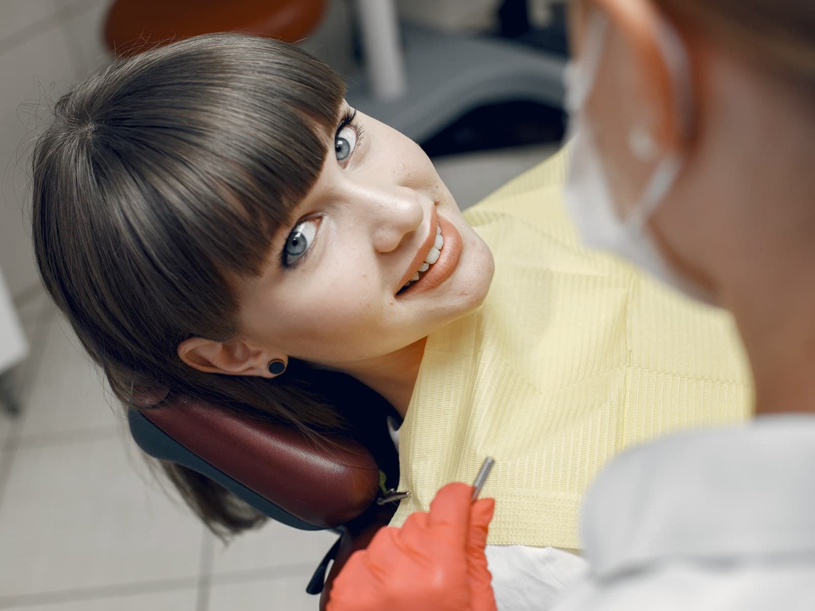 Patient smiling in the dental chair during treatment