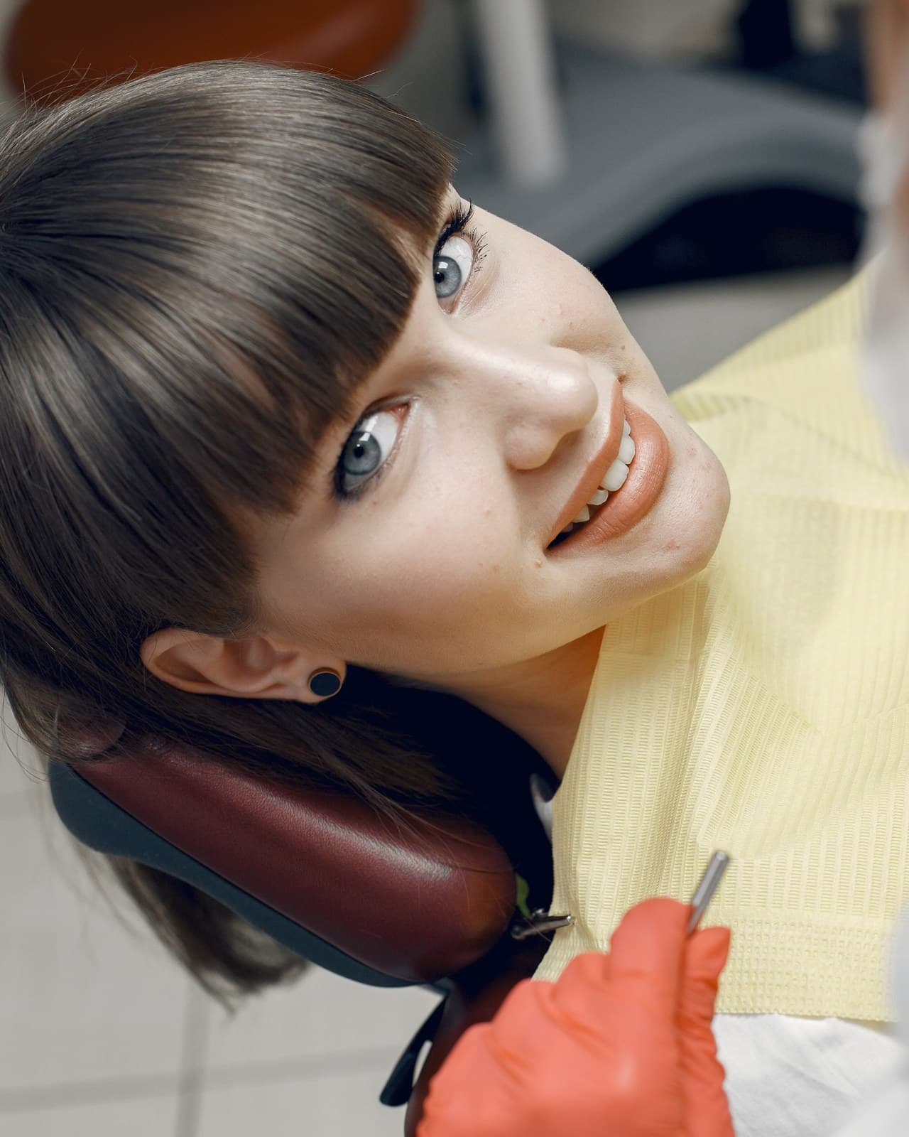 Patient smiling in the dental chair during treatment